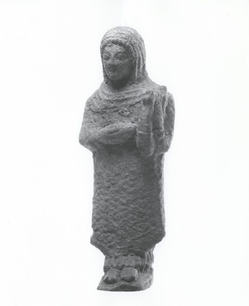 Limestone votive figurine of a veiled girl playing a lyre. Cyprus, circa 600-475 BCE.